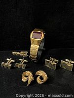 Entire lot showing watch, three cufflink pairs, tie clip and earrings