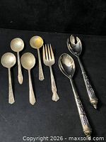 Group shot of all eight pieces on black background