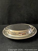 Lidded dish assembled showing oval profile and beaded rim