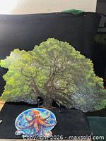 Oak tree and octopus wooden jigsaw puzzles displayed assembled