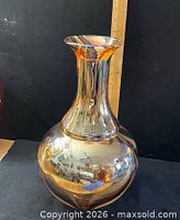 Full view of vase showing bulbous body and flared neck