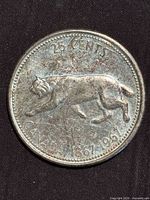 Reverse of 1967 25-cent coin showing bobcat design and date 1867-1967