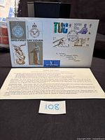 Front of first day cover showing stamps, cancel, artwork and address