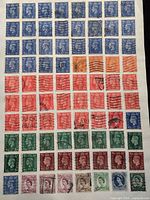 Full album page showing grid of 72 British definitive stamps in various colours