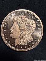 Obverse showing Morgan Liberty portrait, legend E PLURIBUS UNUM and stars
