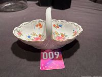 Full view of divided dish showing floral pattern and handle