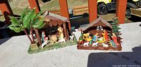 Both plastic nativity manger scenes side by side