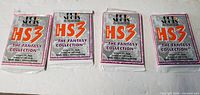 Front view of four sealed Hot Shots HS3 Series 1 The Fantasy Collection card packs