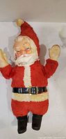 Front view of plush Santa doll standing upright
