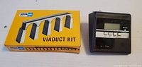 Front of Atlas N Scale Viaduct Kit box beside Weslo controller