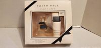 Front of sealed Faith Hill Parfums gift set showing perfume bottle and lotion
