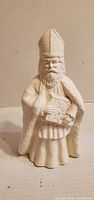 Front view showing full details of unpainted ceramic king figurine