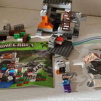 Overview of instruction booklet, partial cave build, loose bricks