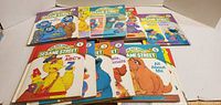 Front covers of eight of the On My Way with Sesame Street board books, showing series numbers and titles