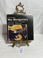 Front cover of Wes Montgomery Full House LP on display stand