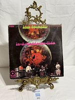 Front cover of the Iron Butterfly LP on display stand