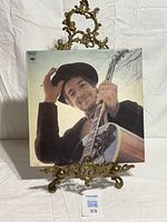 Front sleeve showing Bob Dylan tipping hat