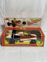 Front of boxed Woodstock Formula A-1 racing car showing clear window and graphics