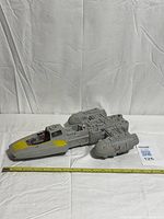 Top view of Y-Wing Fighter showing overall condition and measuring tape