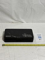 Closed Keeler Vista case with measuring tape for scale