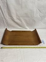 Top view of whole teak bentwood tray with tape measure showing length