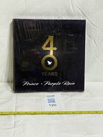 Front view showing title, slipcase, shrinkwrap