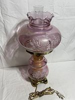 Full view of lamp unlit showing glass color and floral design