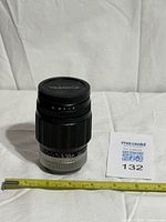 Front view of lens with Yashica cap and measuring tape