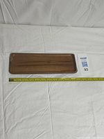 top view of sealed teak tray with tape measure showing length
