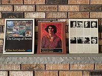 front of box, calendar cover, back artist bio insert displayed