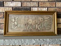 Front view of framed embroidered sampler