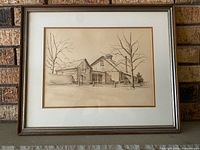 Front view of framed barn watercolour with mat and frame visible