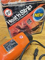 Black & Decker Heat'n Strip heat gun next to original box