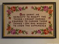 Framed floral needlepoint sampler with Serenity Prayer text