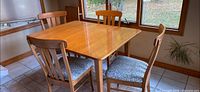 overall view of table with four chairs around it