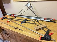 overview of all clamps on workbench including pipe, bar, quick-grip and small miter clamp