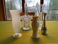 All five vases displayed on table front view