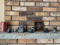All five items lined on mantel beside Coke can