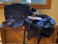 Overall view of Wind River laptop bag, Woods backpack, Roots wallet, Rogers Cup pouch and floral pouch