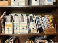 Shelf with ten magazine file boxes filled with woodworking magazines