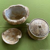 Three Nippon porcelain pieces showing forms and decoration