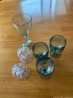 All six plastic stemmed glasses on tabletop