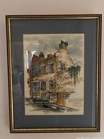 Front view of framed Quebec street scene print