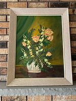 Front view of framed oil painting showing artwork and frame details