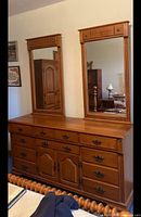 Front view of Roxton dresser with attached mirrors showing drawer layout and finish