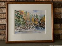 Front view of framed watercolor painting with mat and wood frame