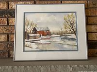 Front view of framed watercolour painting showing image, matting and frame