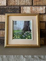 Framed oil painting on mantel showing full frame and image