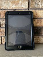 Front view showing integrated screen protector, home button and sensor cutouts