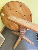 table top underside view showing grain and pedestal base